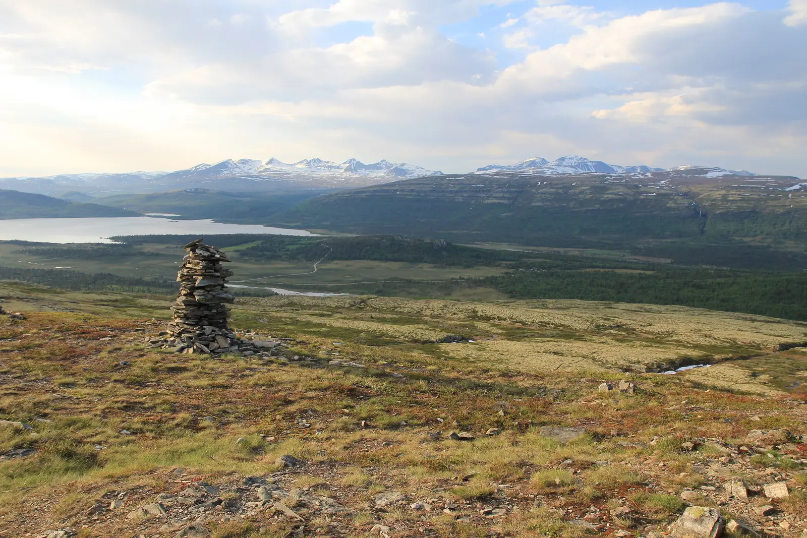 A cairn by a mountain lake